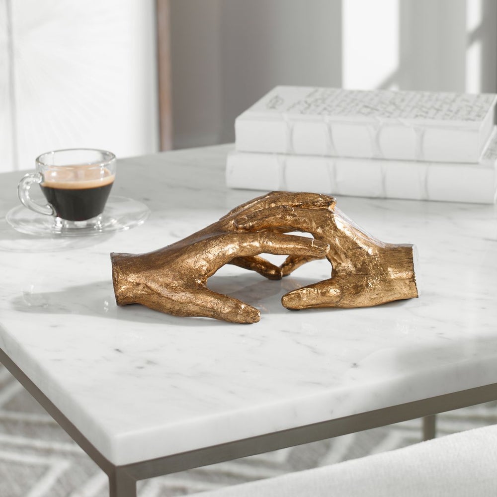 We Bond Gold Sculpture