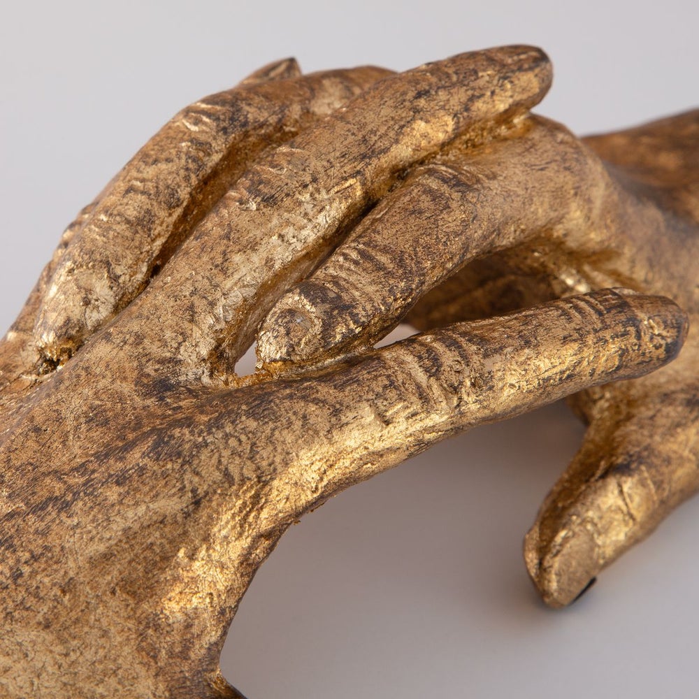 We Bond Gold Sculpture